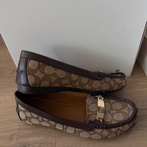 COACH Brown Monogram Loafers with Gold Accent

SIZE: 8.5